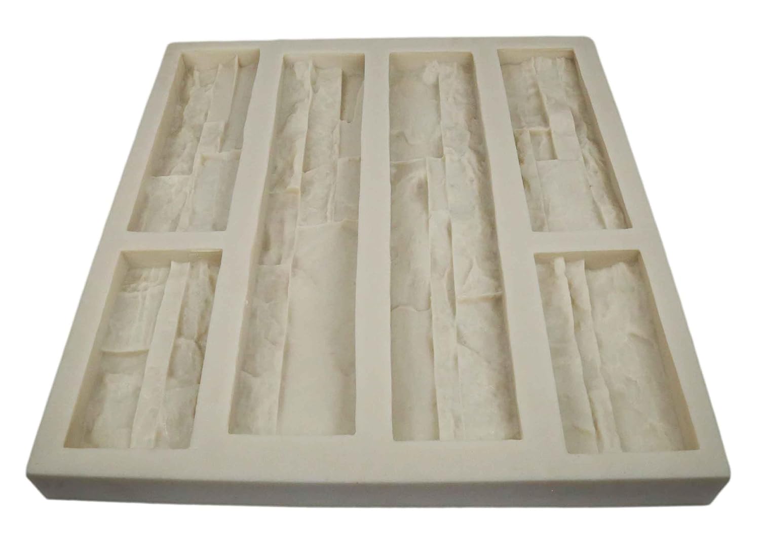Installing Stone Master Molds Rubber Mold Stacked Stone Veneer Panels on a wooden workbench